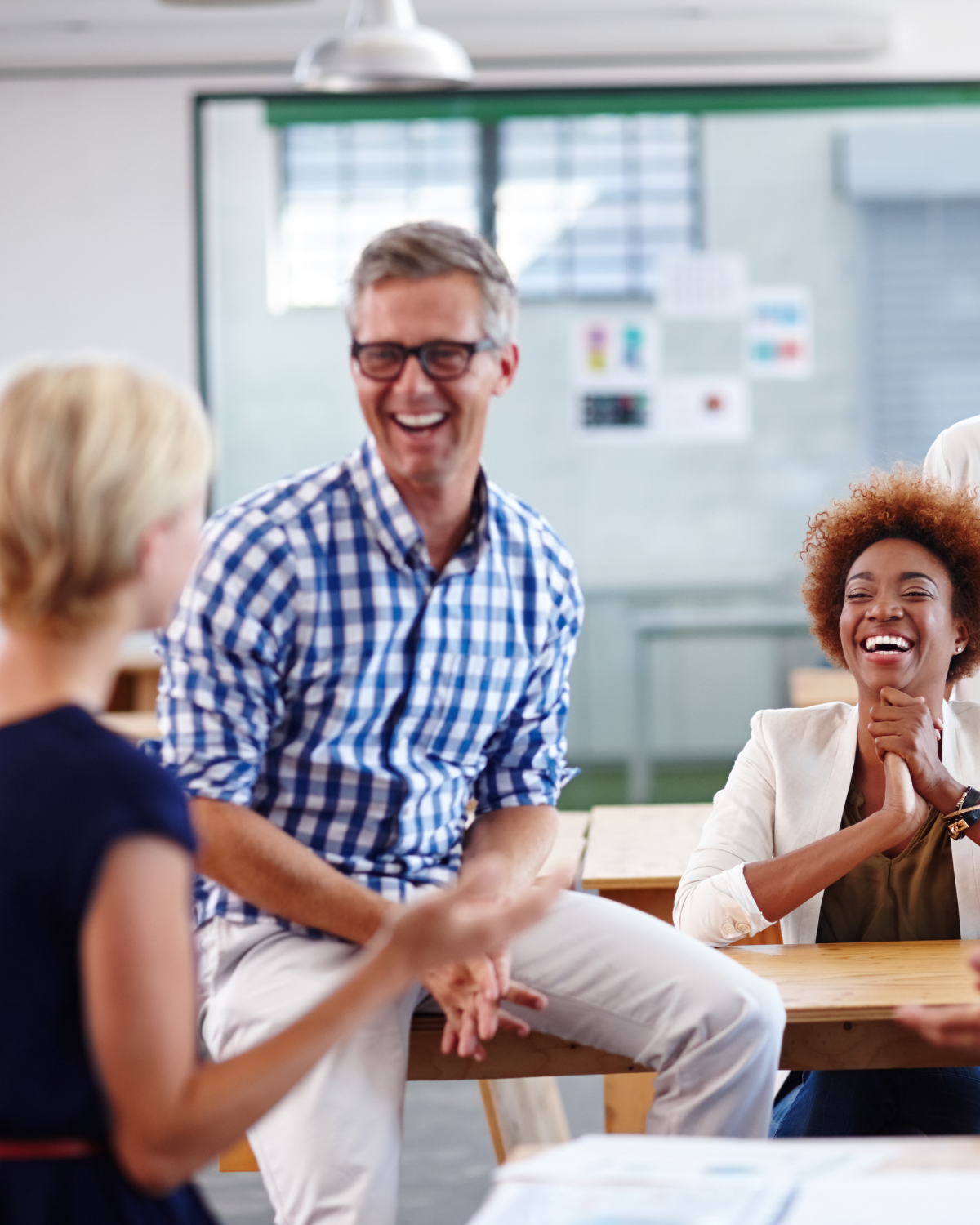 Two colleagues having a supportive conversation in the workplace