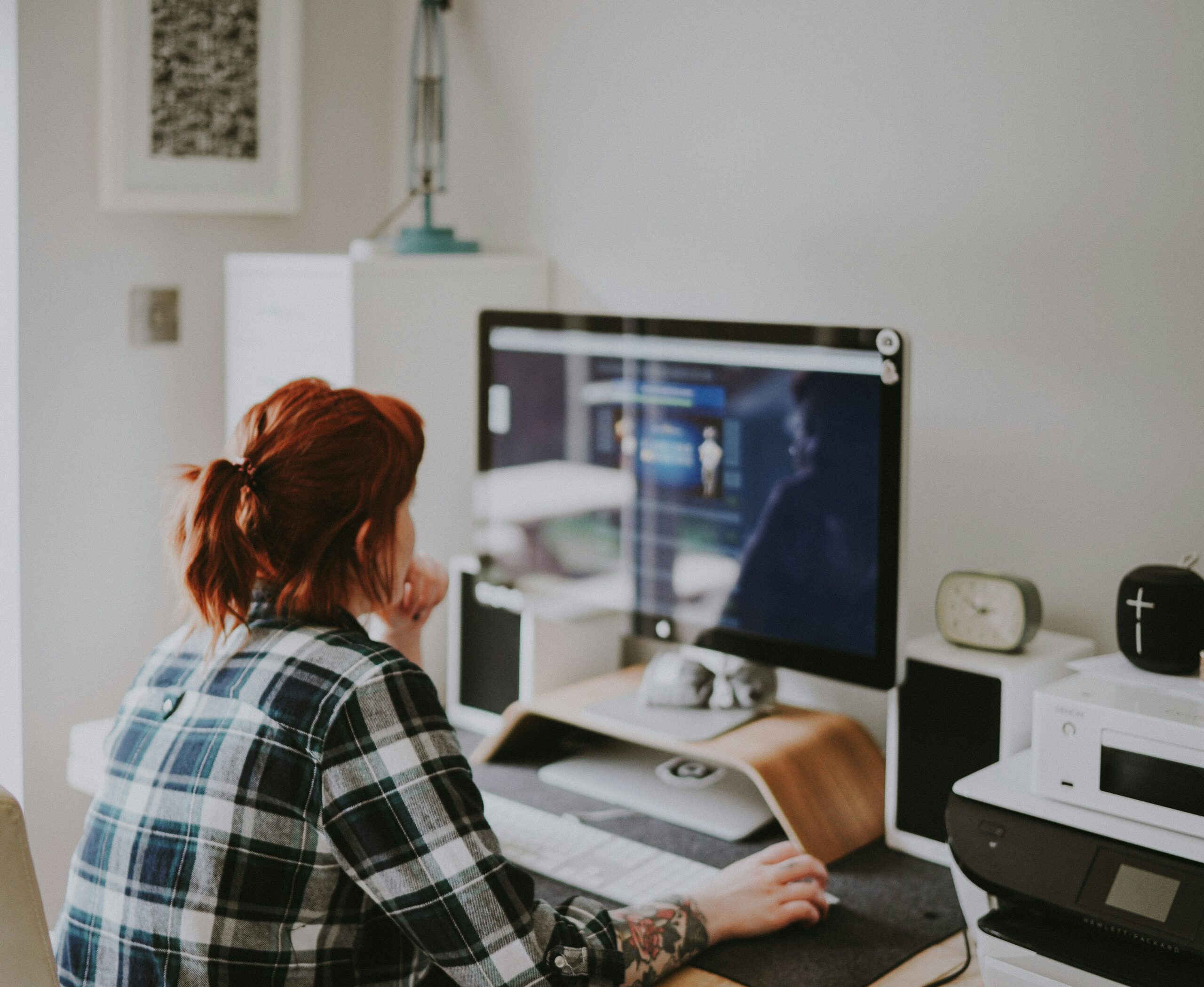 Remote employee working from home at a computer in a home office