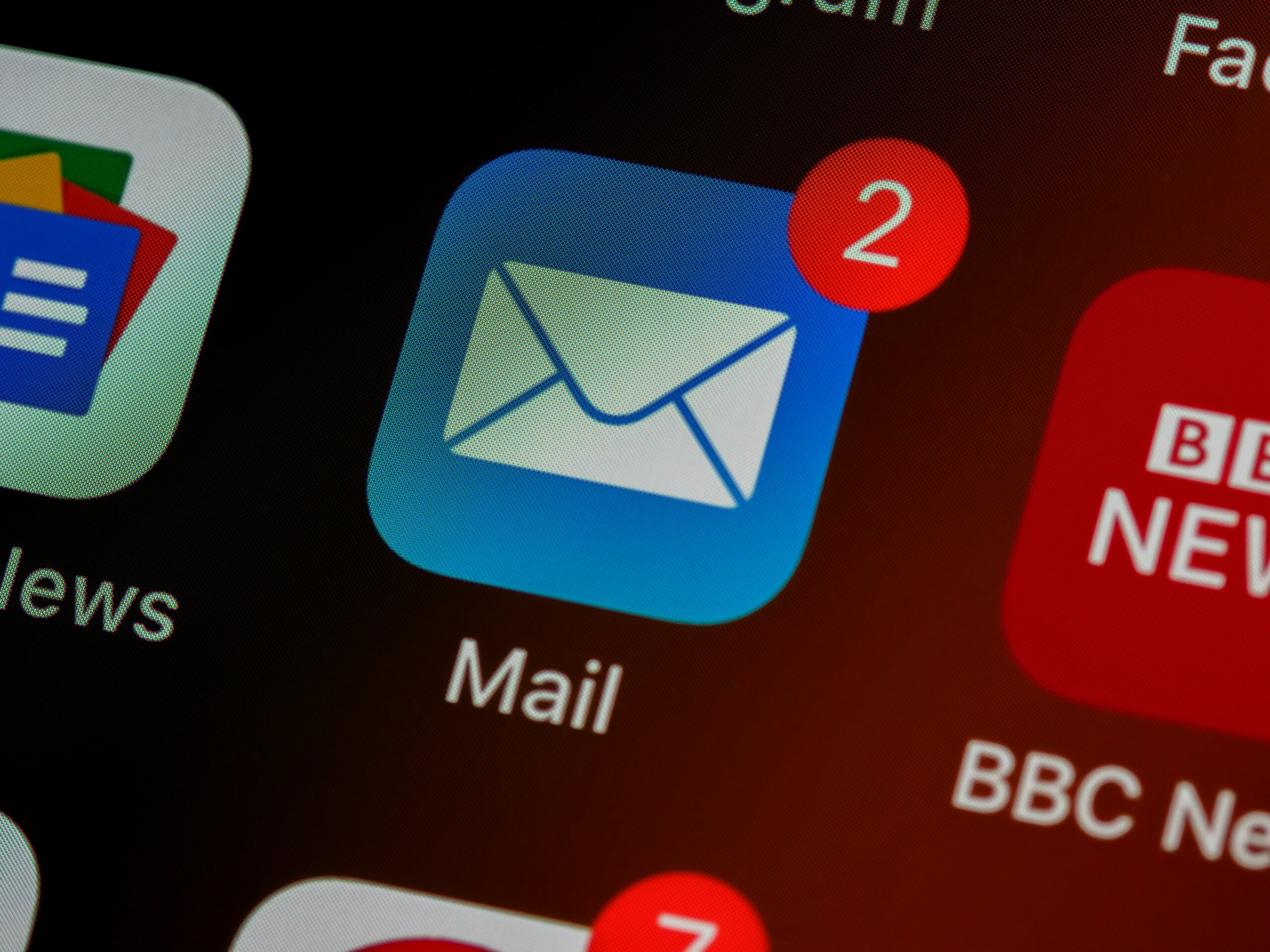 Email app icon with unread message notifications on a smartphone screen