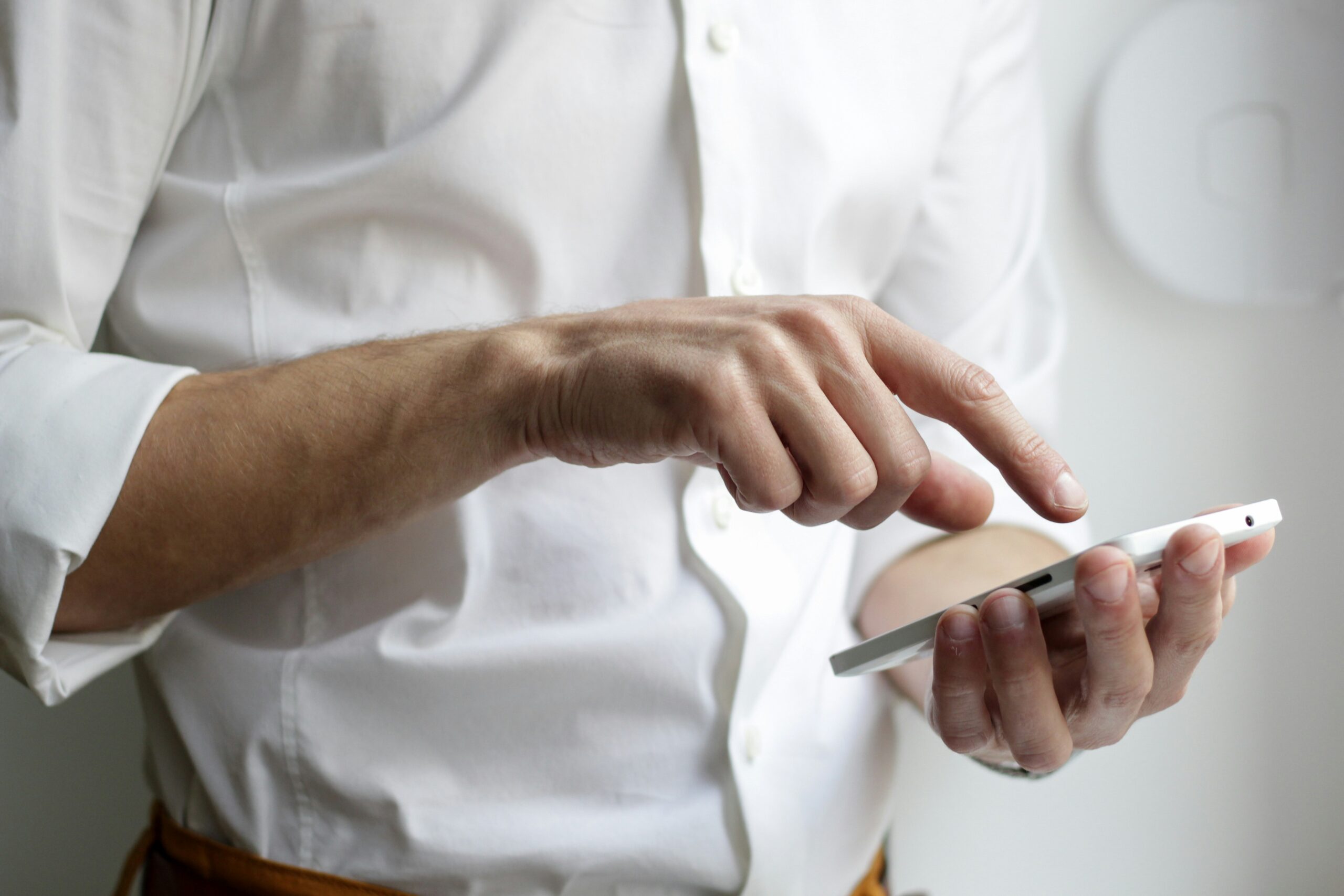 Person using a smartphone to access digital wellbeing platforms